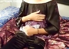 Cumming over black flowery satin top