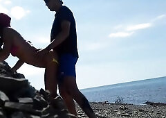 Real amateur doggy position on the public beach. Outdoors sex.