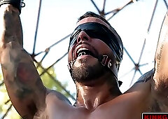 Jona Ortiz gets bound standing again with a metallic stretcher around his balls