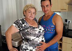 Buxxom gilf sucking & fucking a way younger dude in her kitchen