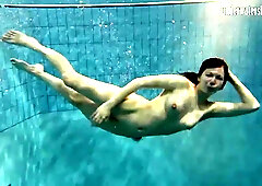 Hot babe swims in the sea like a mermaid