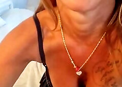 Busty MILF Teases in Leather Skirt