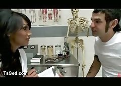 Guy licks feet to busty tranny in clinic