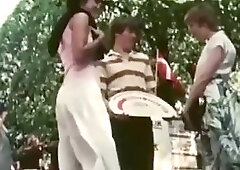 Frisky brunette is sharing a rock hard dick with another lady and moaning while getting fucked