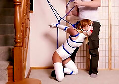 Asian girl in latex bondage and ballet boots