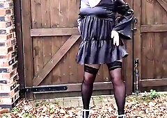 Steaming crossdresser in glorious black satin and pantyhose