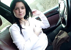 Playing with her tits in the car