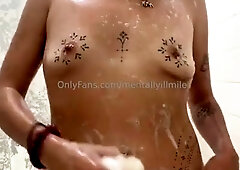 Latina MILF poses naked and plays with herself in the shower