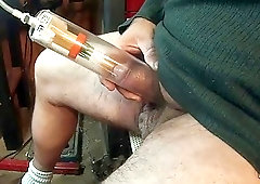 He puts his cock in a little suction pump alone