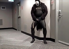 Jerking off in in hotel hall in wetsuit