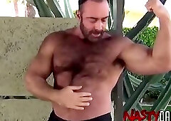 Muscular hairy stepdaddy masturbates and flexes