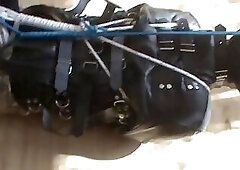 Slave hogtied in the straitjacket