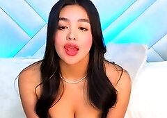 Busty babe playing with her big boobs