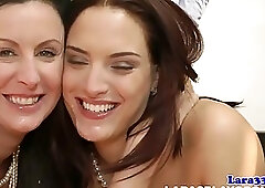 Classy brunette in black stockings and shoes with high heels is having a casual threesome