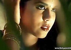 Indian lady is dancing in the middle of the night and slowly taking off her clothes