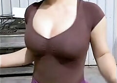 Peruvian woman bounces her large bazookas and shakes her large booty in shorts for coins