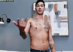 Tattoed skinny jock tugging his dick