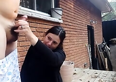 Amateur milf jerking off husband's meat pole outside