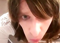 sissy deep-throating a faux-cock