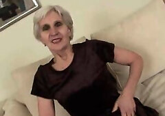 Lewd, golden-haired granny, Viviana is sucking a alternative hard dong and getting her unshaved snatch fucked