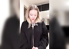 Blond angel lazily unzips her hoodie with the one and the other hands ?