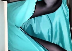 I'm Wearing a lengthy green petticoat with a satin polyester lining and ebony hose.