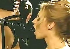 Latex maid takes some orders