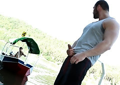 Muscular bottom rides cock on a wooden pier