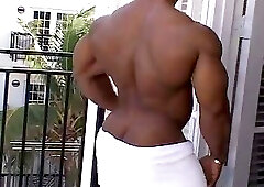 Silvio Samuel Flexing and Posing On A Balcony