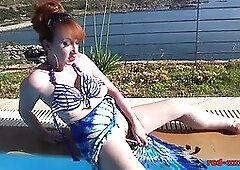 Mature redhead RedXXX fucking and masturbating poolside