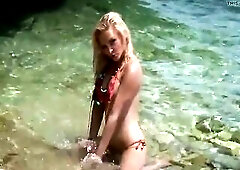 Hot blond and silicone breasty Jena Sweet in beach and play wit that babe body in water