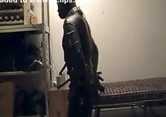 Slaveboy in rubber and shackled having his breakfast