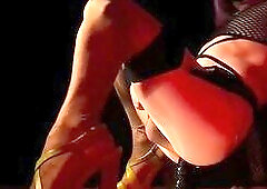 Slutty sissy in high heels put on shiny oil nylons over tights. To slow music that babe stretches her sissy aperture with a ebony sex-toy and squirts 