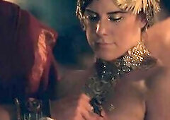 Bonnie Sveen in nature's garb on a daybed as a man has sex with her, 1st standing up beside the couch and holding Bonnie's legs up, then hav