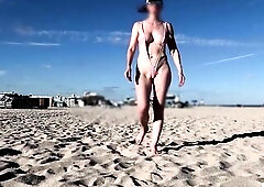 Nude at the beach in a lascivious sling bikini (part 1)