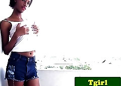 Tall shemale Look Me shows her large ramrod for the camera and plays with it