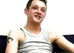 Inked young guy jerks off on interview