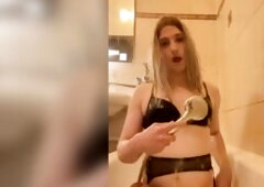 messy bitch with a schlong smokes and bangs her butt with a large sextoy in the baths pouring water over